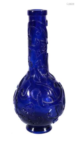 A Chinese carved Peking blue glass vase, Qing Dynasty