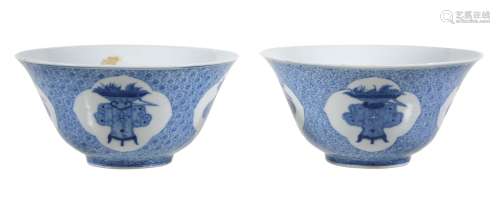 A pair of Chinese blue and white bowls, the exteriors finely painted with...