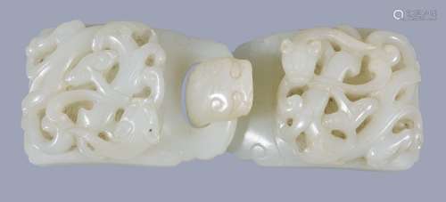 A Chinese white jade double belt buckle, each clasp carved in relief and...