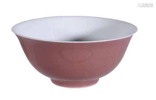 A Chinese copper-red bowl, the deep flaring sides supported on a short foot