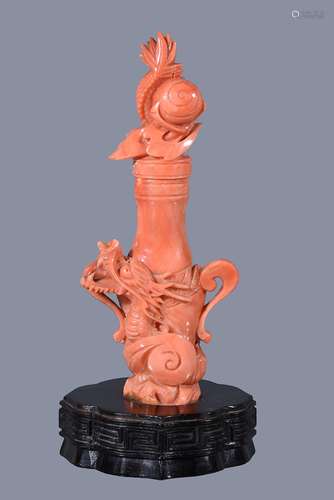 Ω A Chinese coral 'dragon' scent bottle and stopper, of slender baluster form