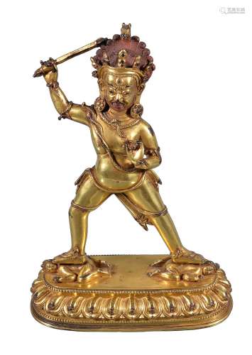 A gilt-bronze figure of the Dharmapala Mahakala , Tibet, circa 17th century