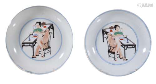 A pair of Famille-Rose 'Erotic' saucers , each painted in the centre with...
