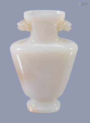 A Chinese white jade vase, of slender ovoid form
