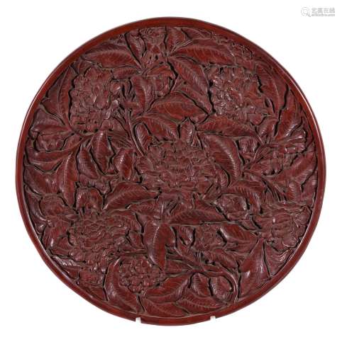 A large Chinese red lacquer tray, in Ming style, of shallow circular form