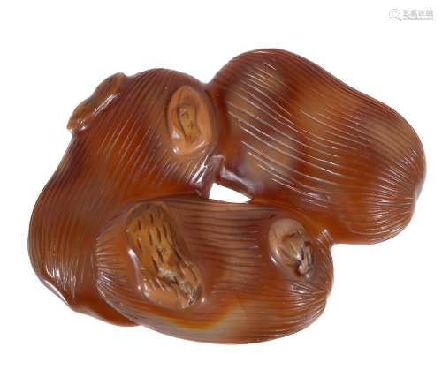 A Chinese honey-agate carving of jujubes and peanuts, Qing Dynasty