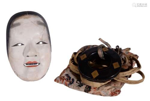 A Japanese Noh Mask, the wood, gesso and lacquered mask carved to the...