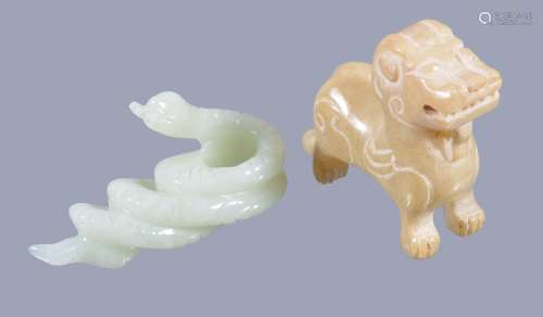 A celadon jade carving of a snake , 6cm long and a Chinese archaic style...
