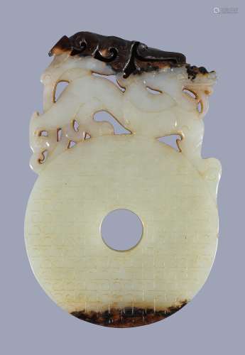 A Chinese celadon and russet 'dragon' disc , bi