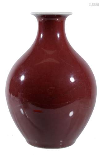A Chinese copper red vase, of ovoid form with flared neck