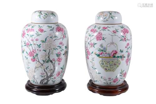 A pair of Chinese Famille Rose jars and covers, late 19th or early 20th century