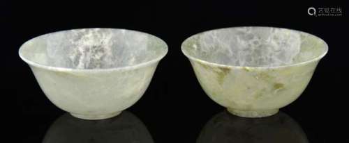 Pair of celadon jade bowls with flared rims, on round feet, each 10cm diameter,