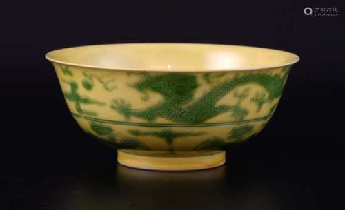 Chinese yellow glazed bowl decorated in green with dragons and phoenix, six character mark to base, 15cm diameter,