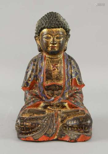 19th century bronze figure of a seated Buddha with painted decoration, 25cm high,