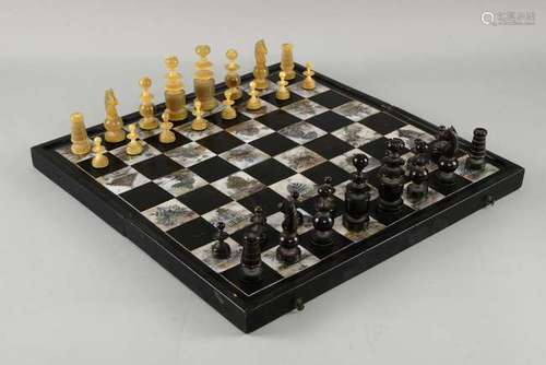 Vietnamese turned horn chess set with ebonised and mother-of-pearl decorated board, kings 7.5cm high, pawns 3.5cm high,