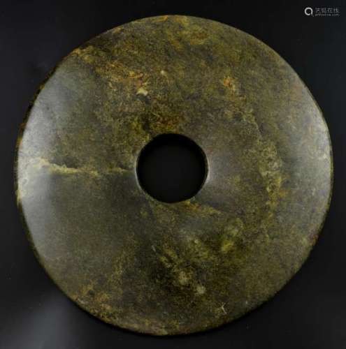 Chinese Neolithic style carved curved jade green and brown mottled bi-disc, 30cm diameter,