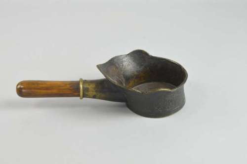 Modern Chinese bronze libation cup with moulded decoration and wooden handle, overall length 27cm,