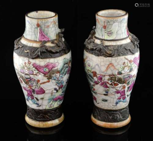 Pair of Chinese famille rose baluster vases decorated with figures and two bands of iron oxide, incised mark to base, 18.5cm high,