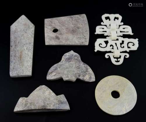 Four pieces of Liangzhu style carved jade with decoration in low relief, a jade bi-disc and a white jade pierced hanging, (6),