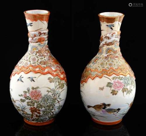 Pair of Japanese Satsuma vases decorated with birds, flowers and foliage and moulded fabric like decoration to the neck and shoulders, painted mark to bases, 22cm high,