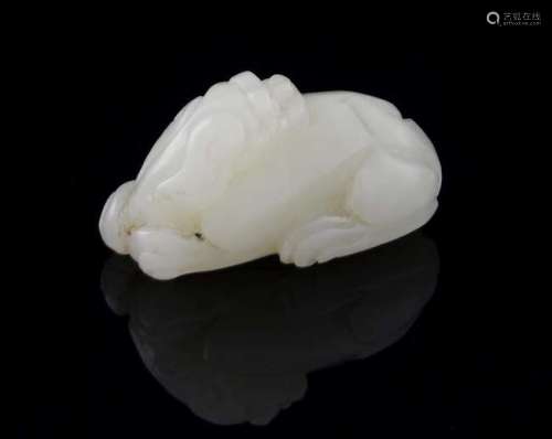 Chinese pale celadon carved jade recumbent lion, 4cm long,