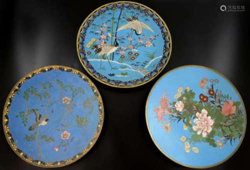 Chinese cloisonne dish, the blue ground decorated with herons, bamboo, flowers and foliage, 30.5cm diameter, and two others similar, (3),