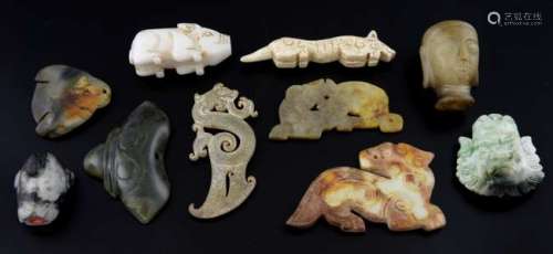 Ten pieces of carved jade to include a white jade pig, head of Buddha, three flat animals, and other items, (10),