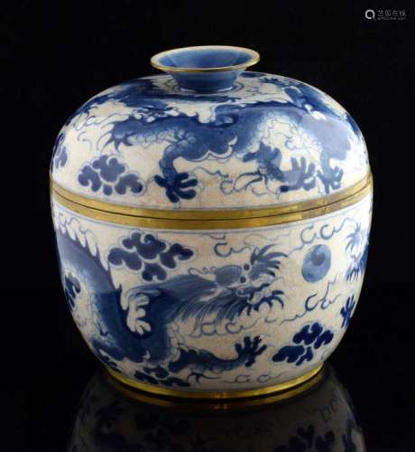 Chinese blue and white crackle glazed jar and cover with brass mounted rims, decorated with dragons chasing the flaming pearl, six character mark to base, 21cm high,