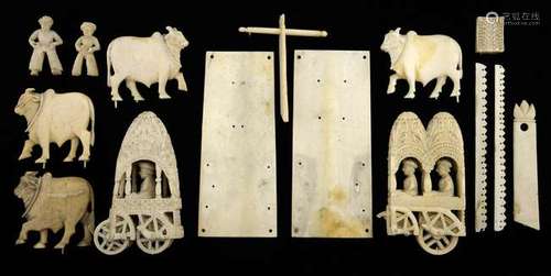 Indian carved ivory figural group of a procession of two carriages and oxen,PLEASE NOTE: THIS ITEM CONTAINS OR IS MADE OF IVORY. Buyers must be aware that regulations of several countries, including USA, prohibit the import of ivory, or any goods co