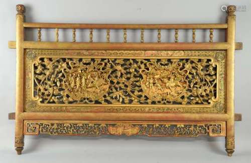 Early 20th century Chinese carved red painted and gilt wood panel, carved with bats and auspicious objects, 61.5cm x 97cm, (probably a panel from a daybed),