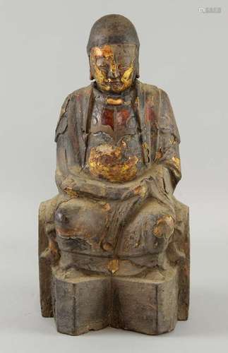 18th century carved wood Buddha with gilt and red decoration, 32cm high,