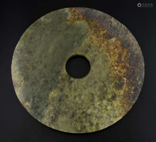 Chinese Neolithic style carved flat jade green and brown mottled bi-disc, 33cm diameter,