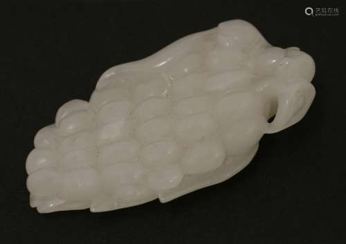 A Chinese jade carving, 20th century, of a tree rat on top of a bunch of grapes, the reverse with a ...