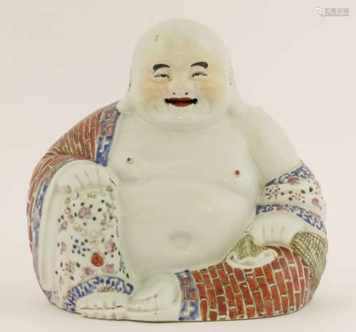 A Chinese famille rose Budai, Republic (1912-1949), his garment painted with brickwork and florets ...