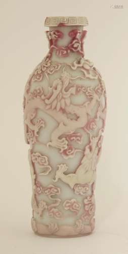 A Chinese overlay Peking glass vase, decorated with dragons chasing flaming pearls amongst clouds, ...