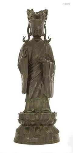 A Chinese bronze bodhisattva of Ksitigarbha, late Ming dynasty, his eyes looking down and with a ...