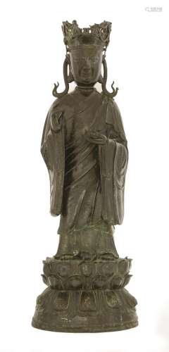 A Chinese bronze bodhisattva of Ksitigarbha, late Ming dynasty, his eyes looking down and with a ...