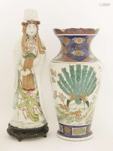 An Arita Kwannon, early 20th century, the goddess standing in robes, white enamelled with dots and ...