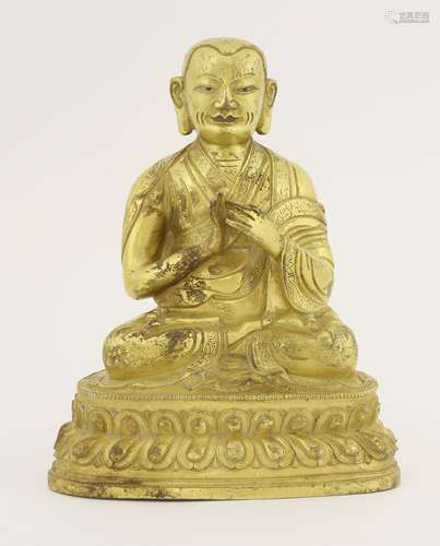 A gilt bronze lama, seated cross-legged on a double lotus throne in dharmachakra mudra, the border ...