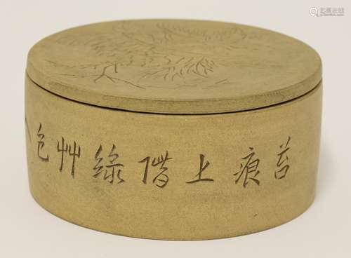 A Chinese yixing box and cover, of circular form, the cover carved with peony and the box with a ...