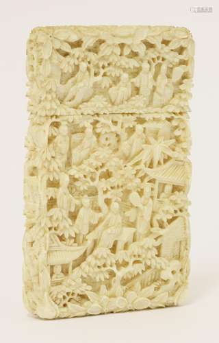 A Chinese Canton ivory card case, mid-19th century, with numerous figures, trees and pavilions in a ...