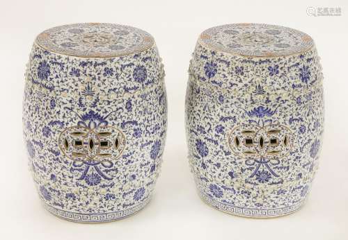A pair of Chinese blue and white garden seats, late Qing dynasty, each drum shape painted with bats ...