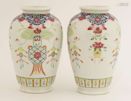 A pair of Chinese famille rose vases, c.1900, painted with a vase with millet and lotus protruding ...