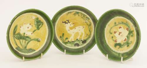 Three Chinese sancai saucers,  Liao dynasty (907-1125), painted with a deer with lingzhi in its ...