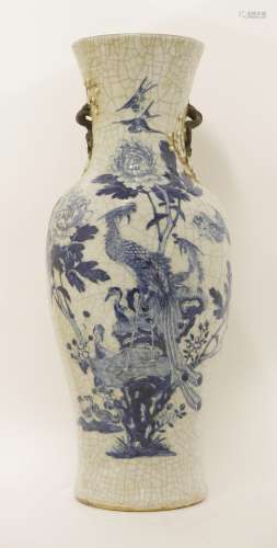 A Chinese blue and white vase, 19th century, of baluster form, painted with a pair of phoenix ...