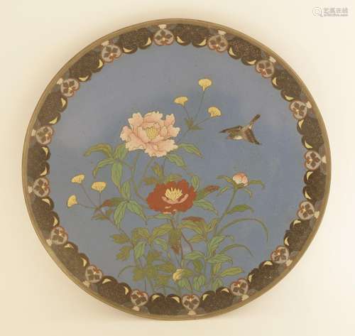 A Japanese cloisonné dish, Meiji period (1868-1912), with a bird flying above flowers, scroll ...