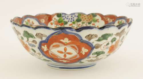 A Japanese Imari bowl, late 19th century, of lobed circular form, painted with flowers and fruiting ...