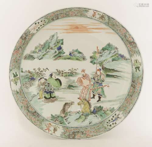 A Chinese famille verte charger, painted with an emperor greeting a scholar, a guard to one side, ...