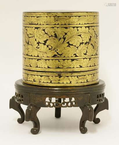 A lacquered box and cover, early 20th century, of cylindrical form with three tiers, the exterior ...