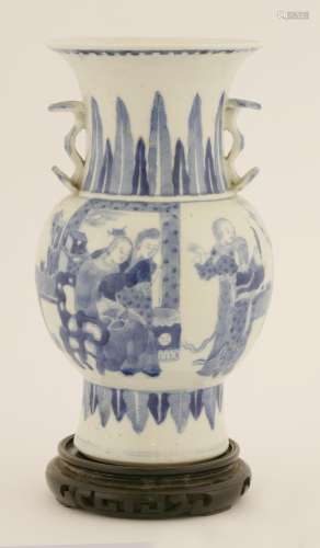A Chinese blue and white vase, late Qing dynasty, of baluster form painted with a couple seated in ...